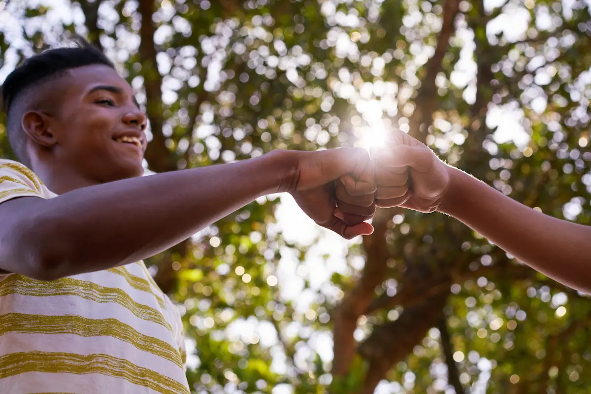 Youth greeting a friend
