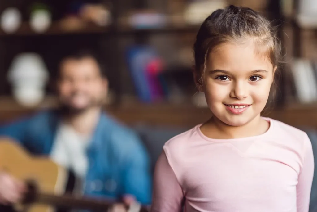 Happy young girl at home with family