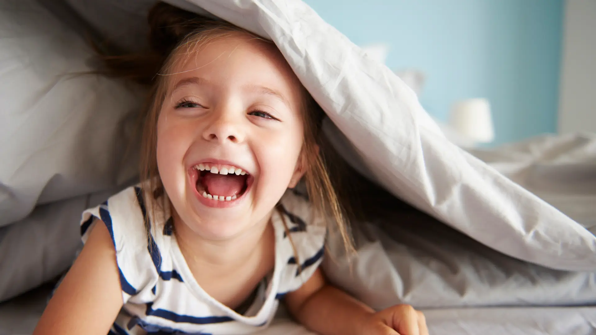 happy young girl playing at home